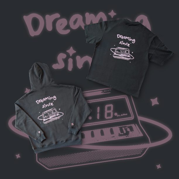 Black hoodie and t-shirt printed with a pink alarm-clock graphic reading Dreaming since